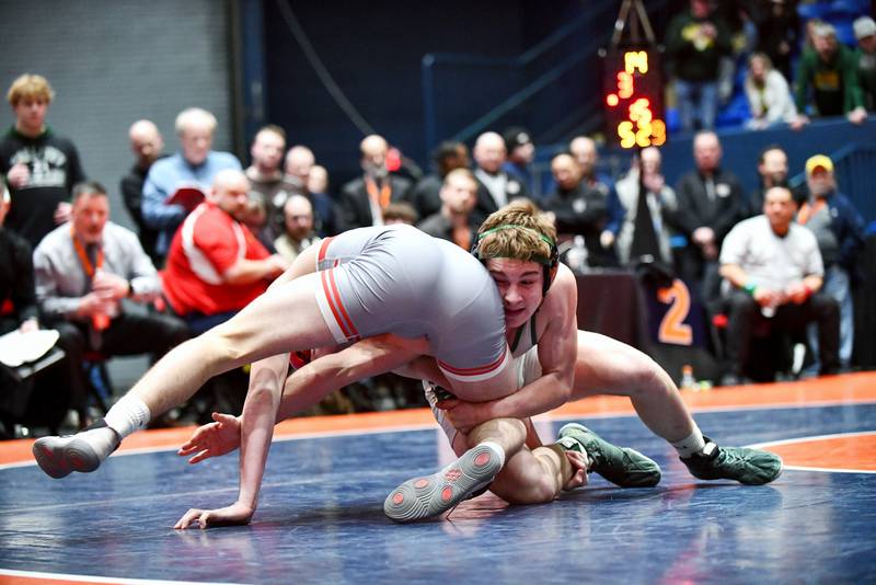 Aidan Kenney of Coal City wrestles Cole Yarbrough of Vandalia during Kenney's 144-pound victory during the IHSA Dual Team State Finals in Bloomington on Saturday, March 1.