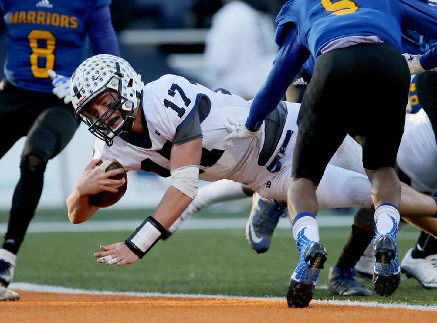 Cary-Grove quarterback Ben McDonald dives in to the endzone for the final Trojan touchdown against Crete-Monee during their IHSA Class 6A state final at Memorial Stadium at the University of Illinois on Saturday, Nov. 24, 2018 in Champaign. Cary-Grove finished off their undefeated season 14-0 with the 35-13 win over Crete-Monee to become 2018 state champions.