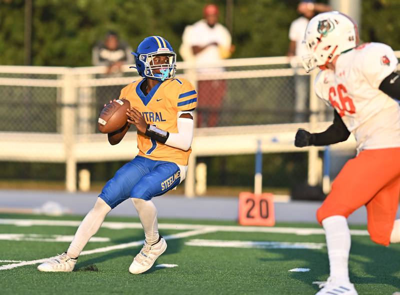 Joliet Central's Jeffrey Woods (7) looks to throw a pass during the conference game against Plainfield East on Friday, SEP. 12, 2025, at Joliet.