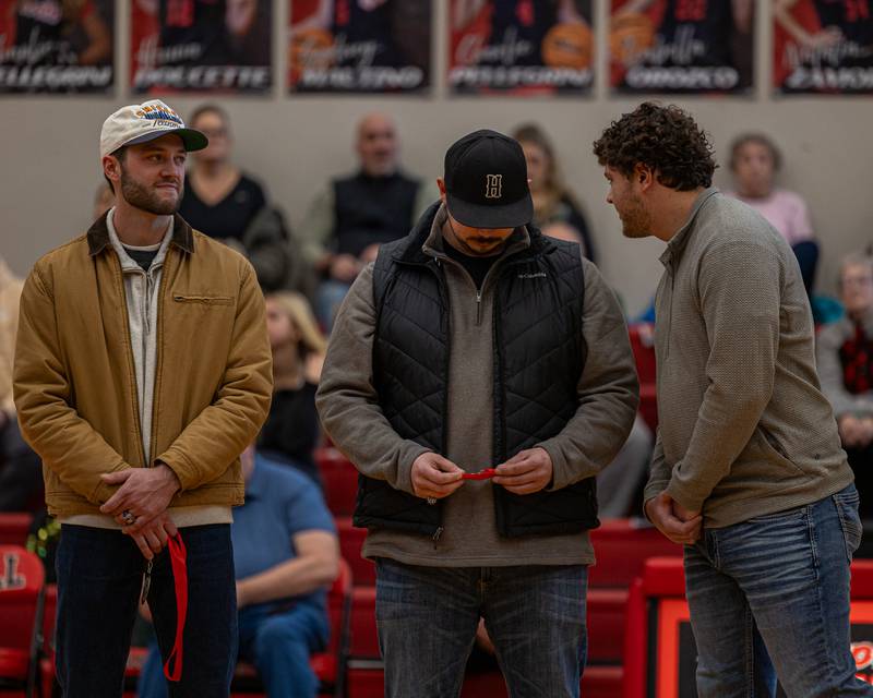 Members of the Hall Red Devils 2018 2A State Champions talk amongst themselves at the 2026 Hall High School Hall of Fame ceremony on Saturday, January 31, 2026 at Hall High School in Spring Valley.