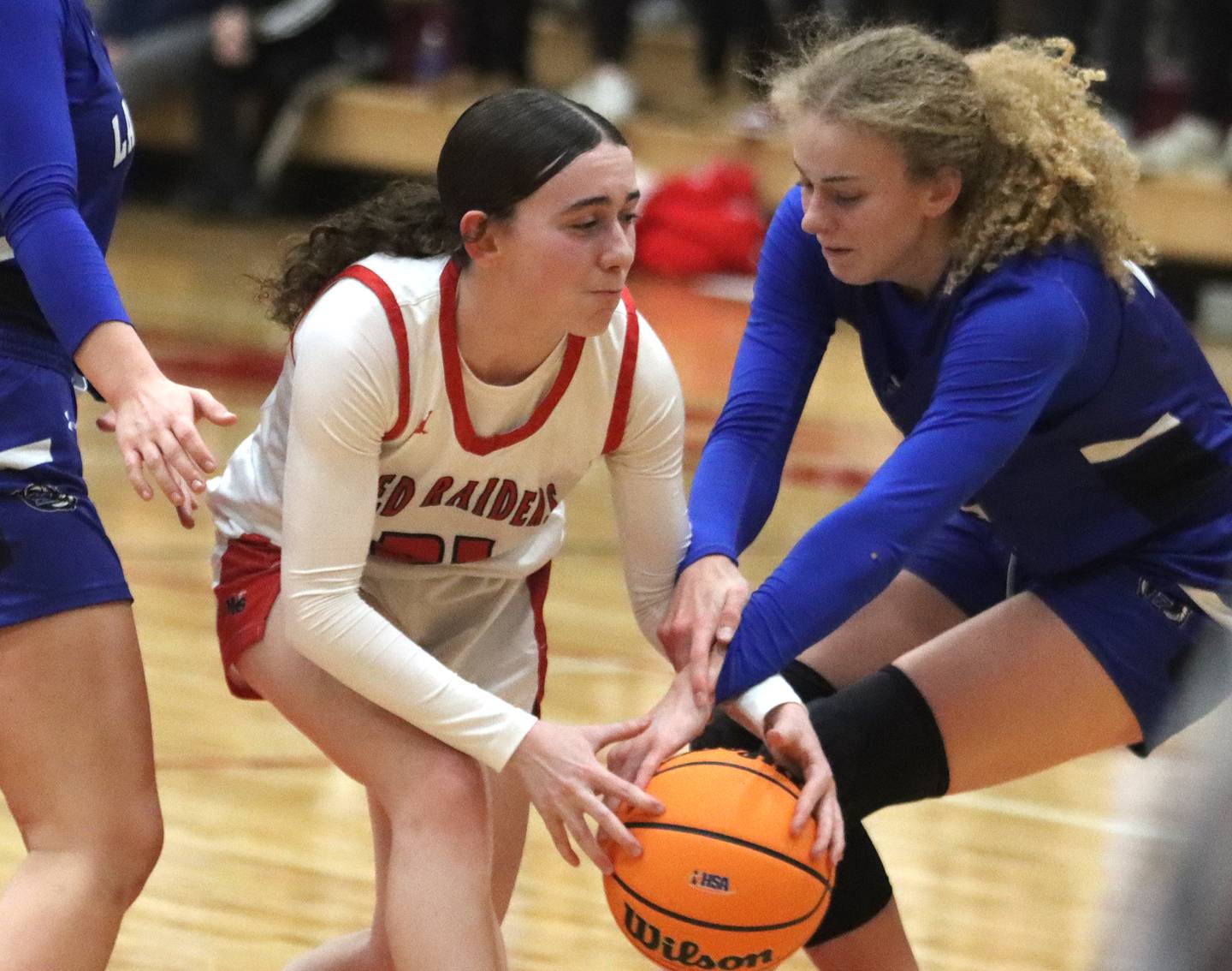 Huntley’s Luca Garlin navigates traffic against Lake Zurich in IHSA Class 4A Sectional girls basketball action on Tuesday, Feb. 25, 2025, at Huntley High School in Huntley.