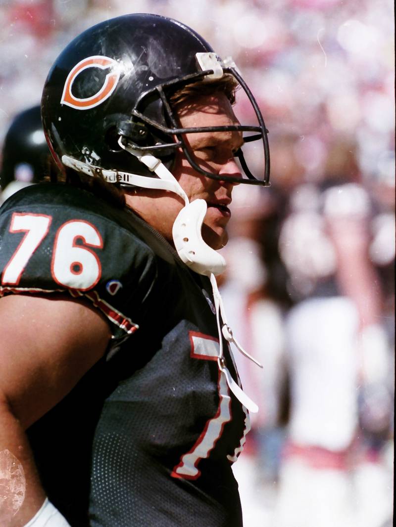 Chicago Bears defensive lineman Steve McMichael watches from the sidelines during a game in 1990.