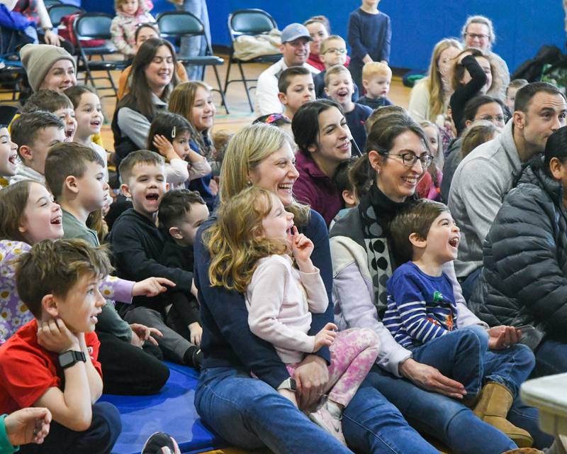 Audience members are all smiles during the magic show by Gary Kantor on Monday Feb. 19, 2024, held at the Main Street Recreation Center in Glen Ellyn.