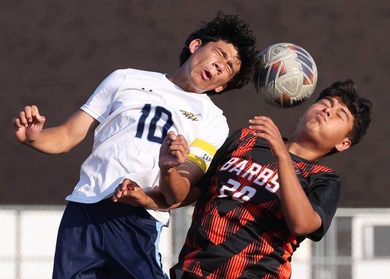 DeKalb's Alan Delgado (right) and Guilford's Luis Rojas go up for a header during their game Thursday, Sept. 18, 2025, at Dekalb High School.