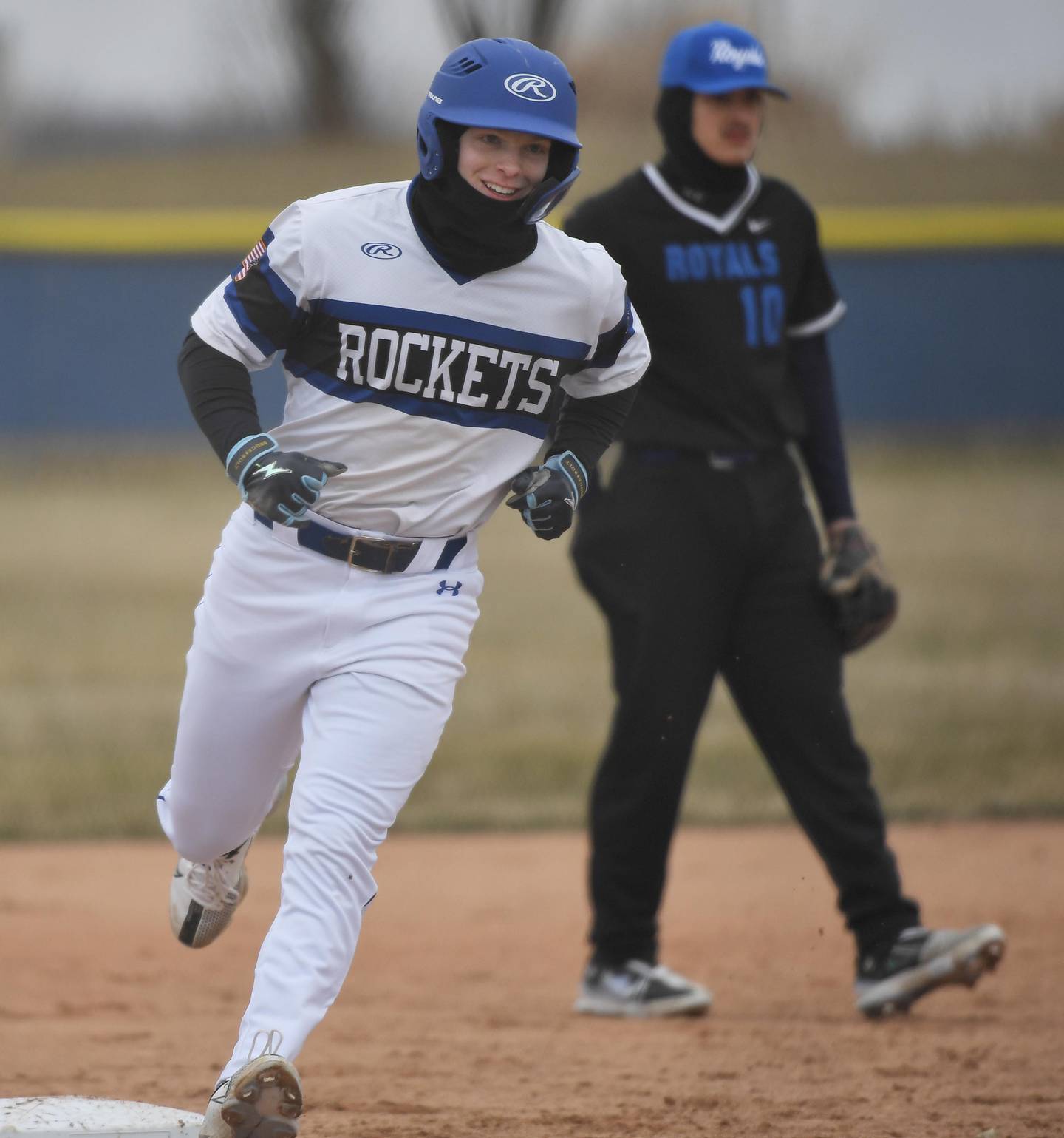 Burlington Central’s Brady Gilroy smiles as he rounds third base with a home run against Larkin in a baseball game in Burlington on Friday, March 24, 2023.