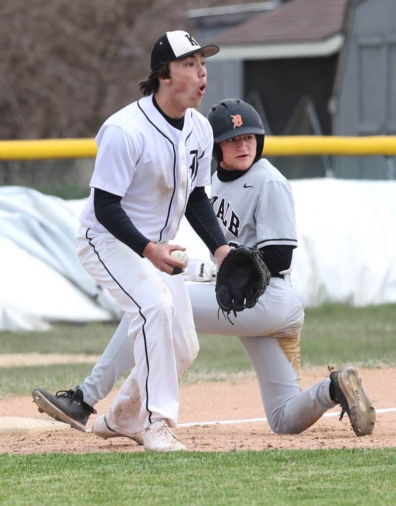 Kaneland's Collin Miller reacts to a the umpires call after DeKalb's Jack Keck was ruled safe at third with a stolen base during their game Friday, April 15, 2022, at Kaneland High School in Maple Park.