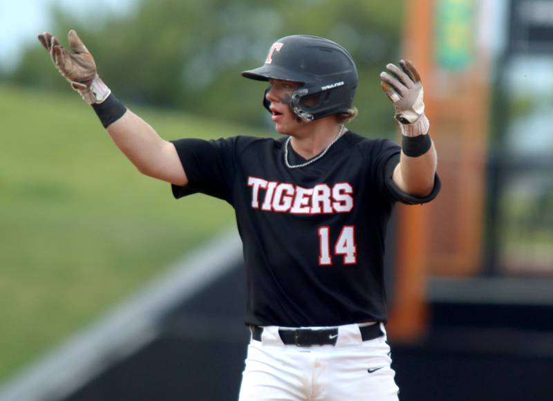 Crystal Lake Central’s Sean Kempf celebrates arriving safely at second base in supersectional baseball action against DePaul College Prep at Wintrust Field in Schaumburg Monday.