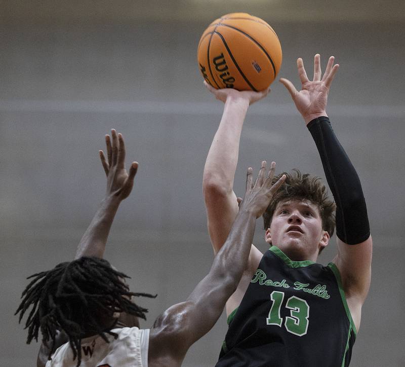 Rock Falls’ Ryken Howard puts up a shot over Winnebago’s Myles Smith Tuesday, March 4, 2025, during the 2A boys basketball Sectional final at Marengo.