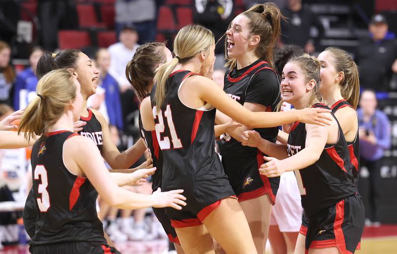 Benet players celebrate as the buzzer sounds in their win over Geneva in the Class 4A state semifinal game Friday, March 3, 2023, in CEFCU Arena at Illinois State University in Normal.