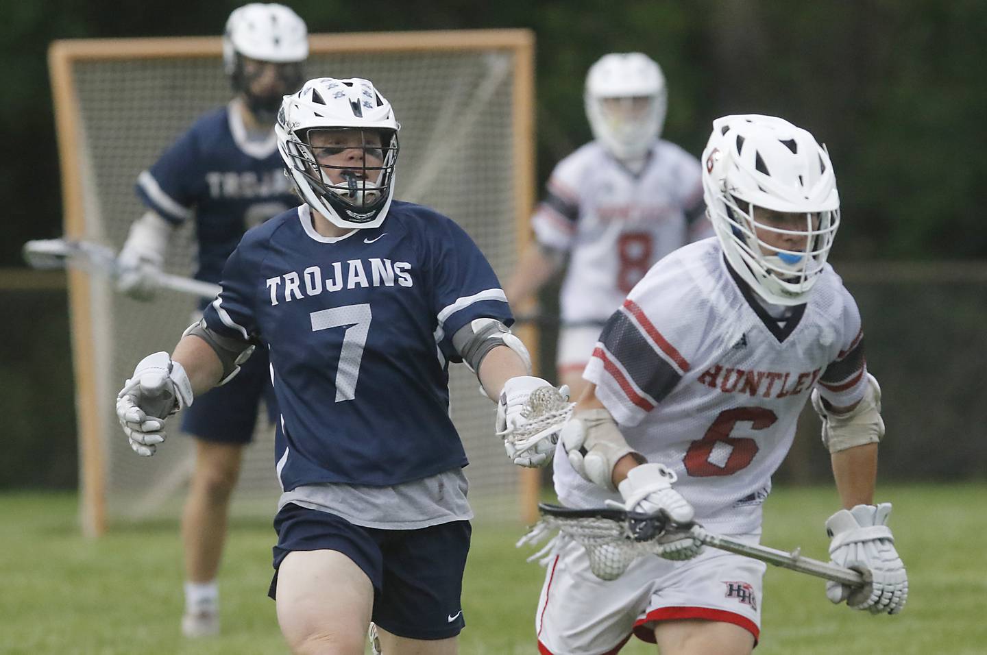 Cary-Grove's Michael Dunkin chases Huntley's Michael Boniak as Boniak runs with the ball during the Marian Central Sectional boys lacrosse semifinal match on Wednesday, May 28, 2025, at Marian Central High School in Woodstock.