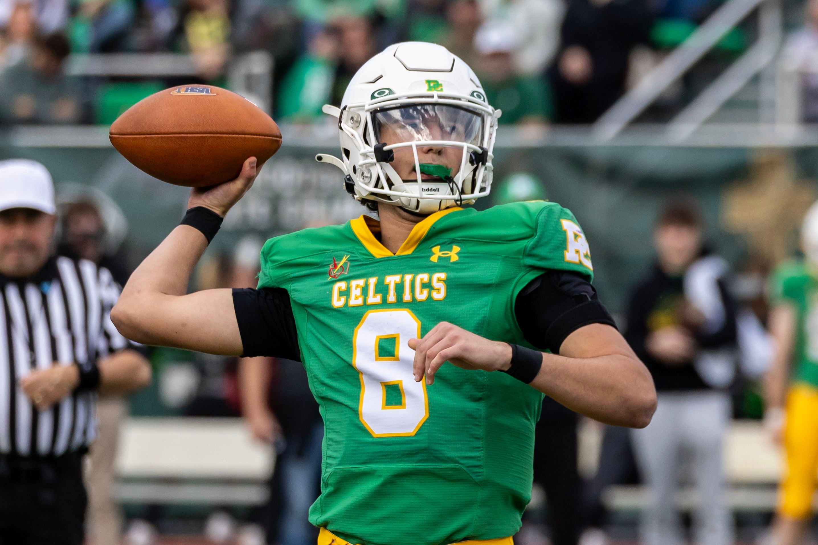Providence's Dominic Vita looks for an open teammate during a 5A varsity football playoff game against Washington at Providence on Nov. 15, 2025.