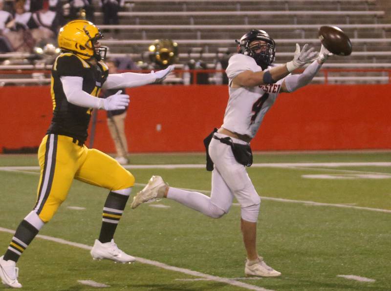Rochester's Jack Buecker misses a pass while St. Laurence's Kyle Richardson defends during the Class 4A State football championship on Friday, Nov, 24, 2023 at Hancock Stadium in Normal.