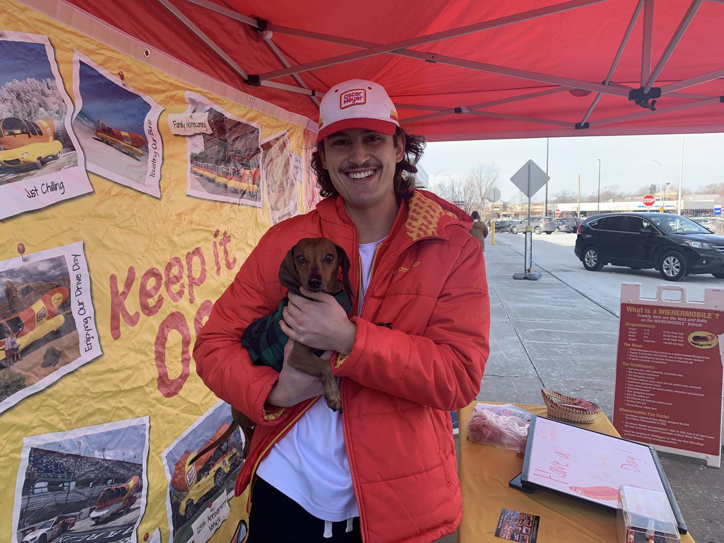 Brandon Mazzaferro of Crystal Lake and the driver of the Oscar Mayer Wienermobile with his wiener dog, Reggie, outside Mariano's in Crystal Lake on Sunday, Jan. 16, 2022.