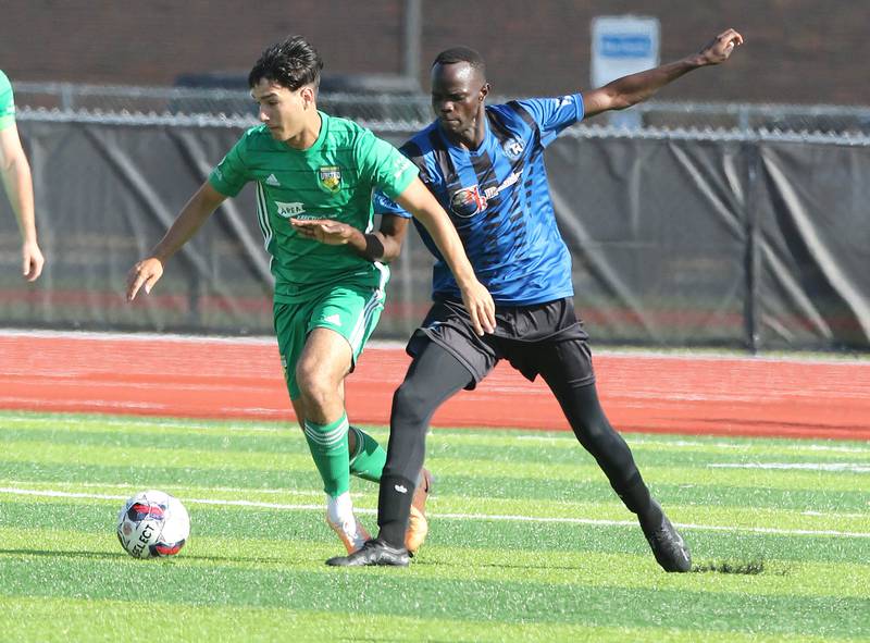 DeKalb County United's Zane Walters (left) keeps the ball away from a Rockford FC defender during their game Saturday, July 29, 2023, at the Soccer & Track and Field Complex at Northern Illinois University in DeKalb.