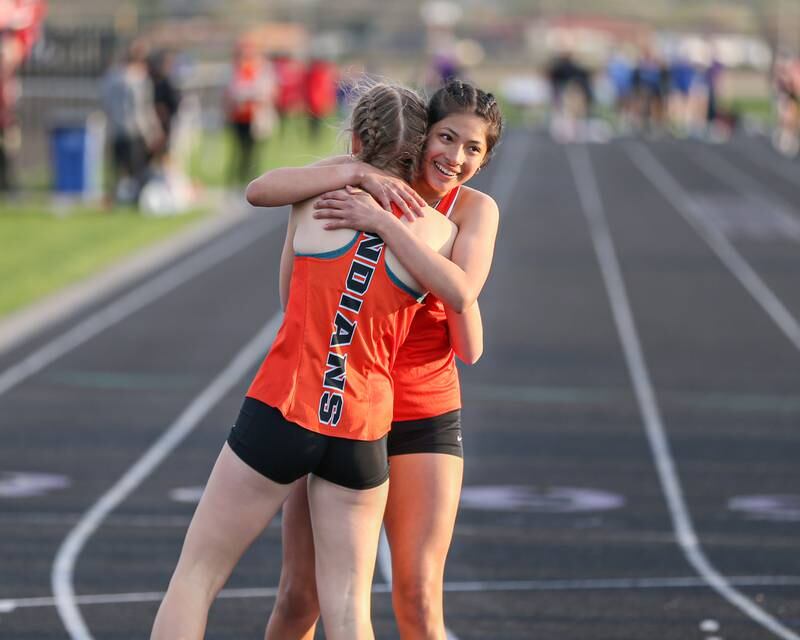 Sandwich's Joanna Rivera hugs Erin Lissman after finishing first and second in the 800 meters at the Field of Dreams Plano Invitational.  April 21, 2023.