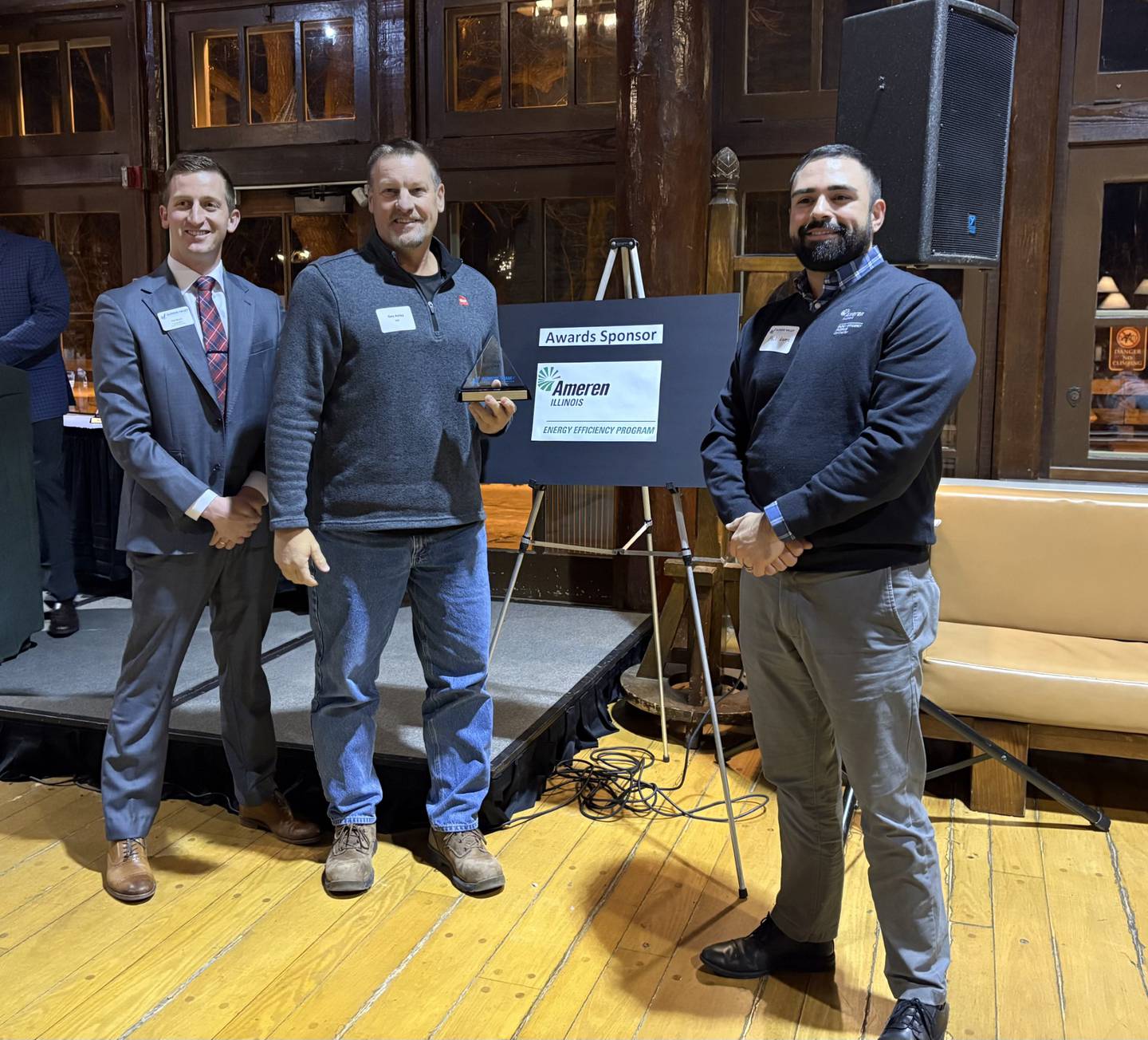 Neal Knauf, Gary Ashley of GAF, and Phil Lopez of Ameren pose after GAF received the Business Builder Award at the Illinois Valley Area Chamber of Commerce annual dinner Wednesday, Dec. 10 at Starved Rock Lodge.