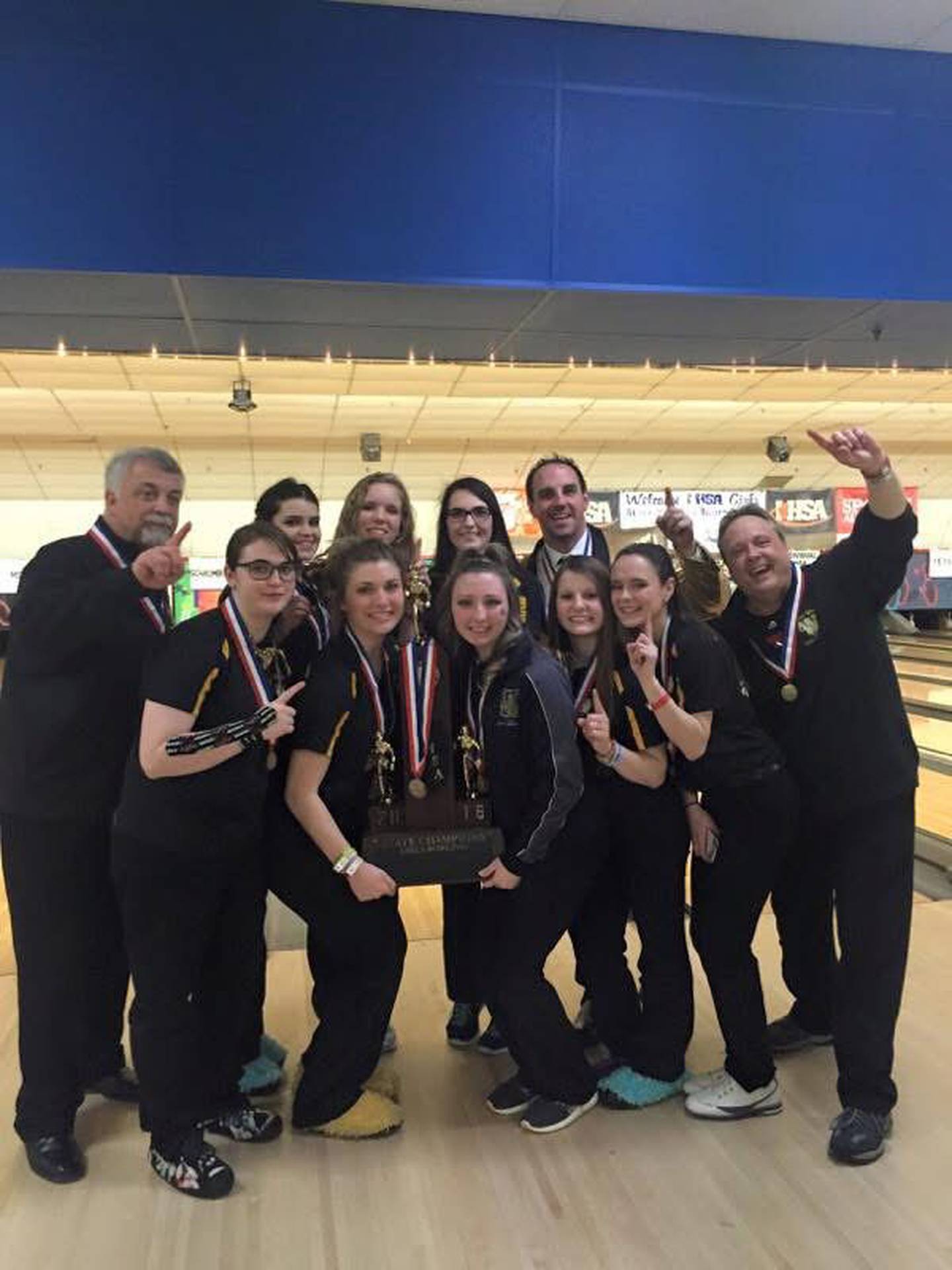 Jeff Bailey (far right) celebrates with the Joliet West girls bowling team after winning the state championship in 2016.
