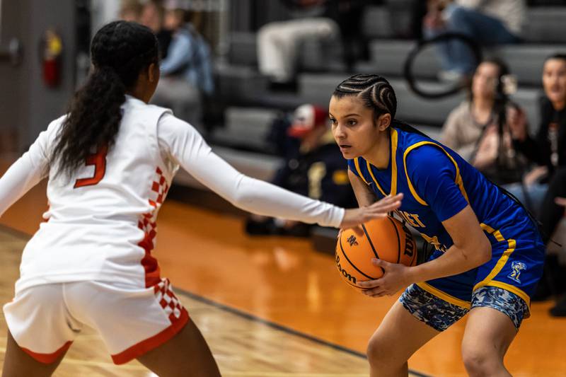 Minooka's Kendall Thomas and Joliet Central's Nevaeh Wright face-off during a WJOL Girls Basketball Tournament game at Minooka on Nov. 19, 2025