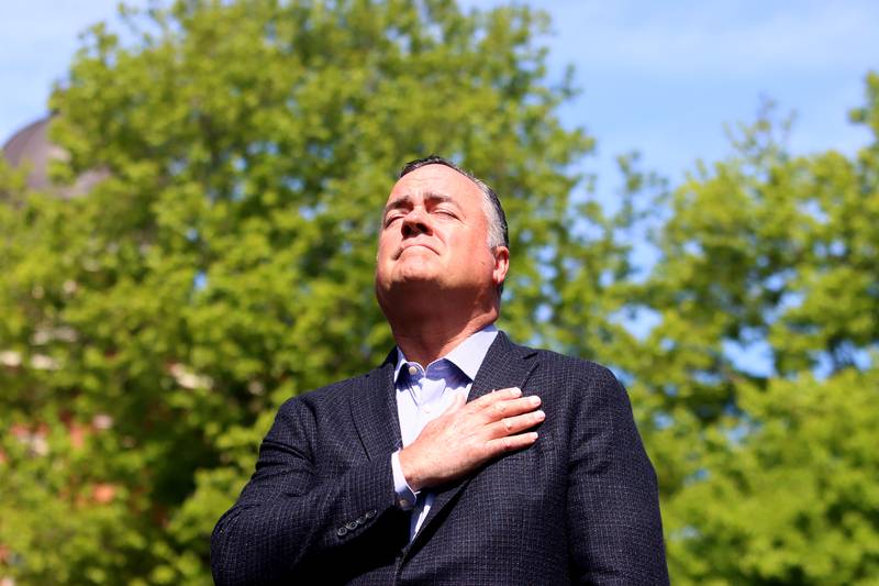 Woodstock Mayor Michael Turner pauses after presenting a new flag for unfurling during a Memorial Day service and parade in downtown Woodstock on Monday, May 26, 2025.