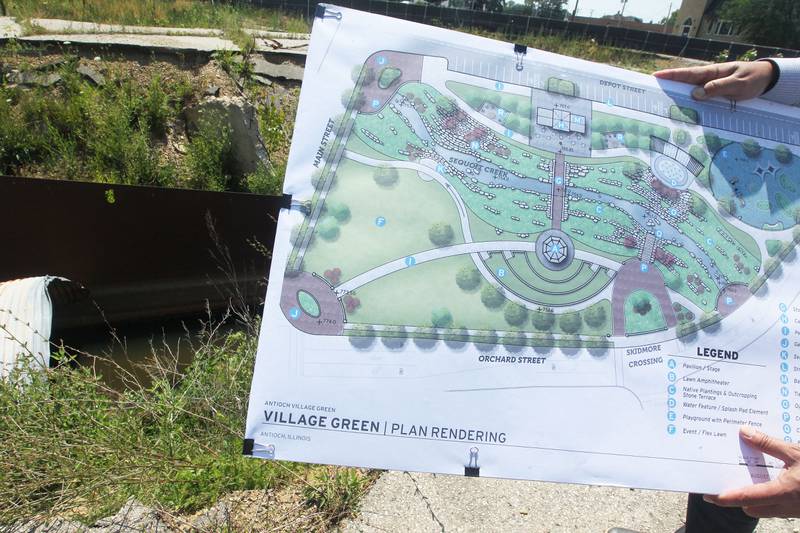 Jim Keim, village administrator, holds the plan rendering with Sequoit Creek in the background to show how Sequoit Creek will run through Downtown Community Open Space Redevelopment Project of the village owned property at Main & Orchard in Antioch on July 10th, 2023. The creek will be the focal point of the park.
Candace H. Johnson for Shaw Local News Network