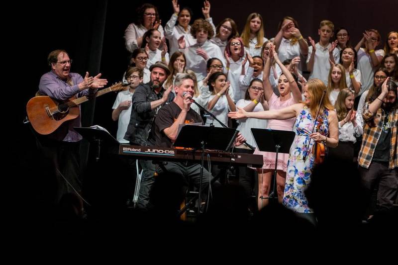 Drauden Point Middle School choir director and music teacher Tim Placher (at the piano) and members of the Drauden Point choir perform at the Rialto Theater in Joliet on February 8, 2020.
Placher is hosting a new showcase for St. Patrick's Day 2022, which will feature local musicians including students from Drauden Point.