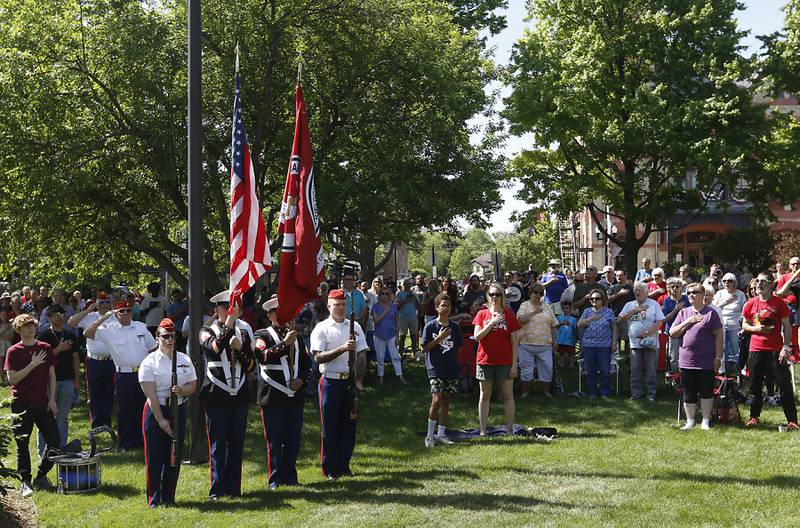 People recite the Pledge of Allegiance during the Woodstock VFW Post 5040 City Square Memorial Day Ceremony and Parade on Monday, May 29, 2023, in Woodstock.