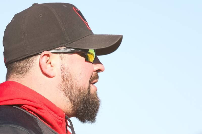 Bolingbrook head coach Christopher DeSanto coaches from third base against Plainfield Central on Wednesday, March 20, 2024.