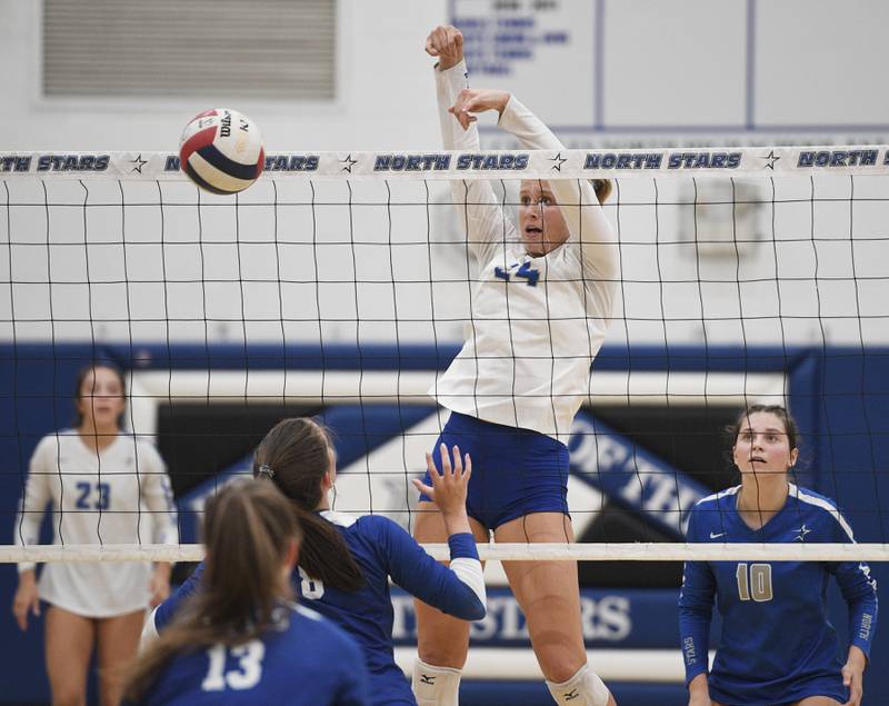 St. Charles North’s Katherine Scherer blocks a shot toward Rosary’s Sarah Schmidt in a girls volleyball game in St. Charles on Monday, August 22, 2022.