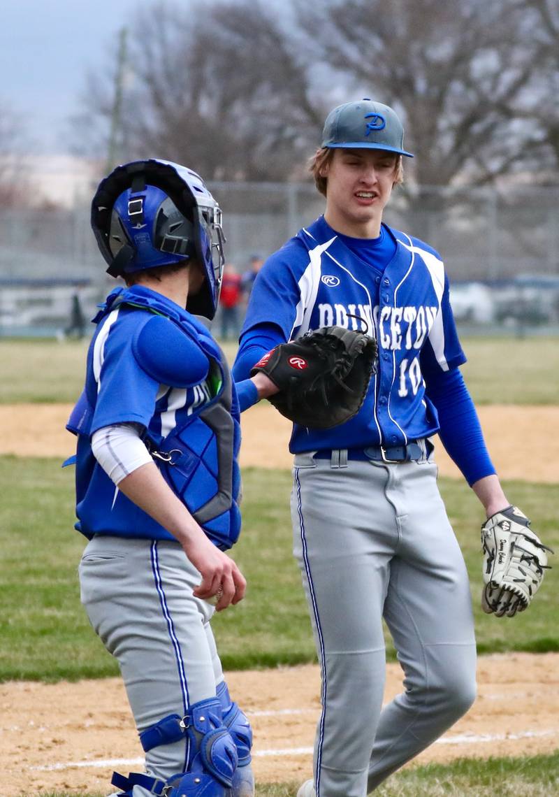 Princeton pitcher Danny Cihocki (right) gives a fist bump to his catcher Ace Christiansen after defeating rival Hall 4-1 Monday at Prather Field. He struck out 14.