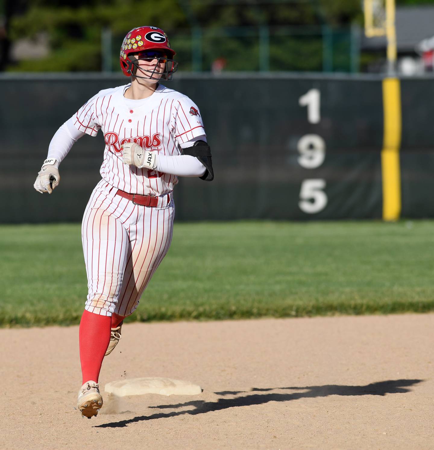 Glenbard East’s Lilly Carver rounds second after hitting her second two-run home run of the game, which put her team up 11-0, thus ending the contest  due to the 10-run rule during the Elk Grove regional semifinal softball game on Wednesday, May 20, 2026 in Elk Grove Village.