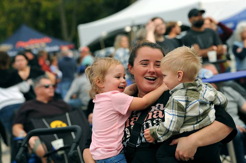 Kristen Meadows dances with her kids 2-year-old Kinsley and 1 year-old Caden during Yorktoberfest, Saturday, Sept. 28, 2024, in Riverfront Park in Yorkville.