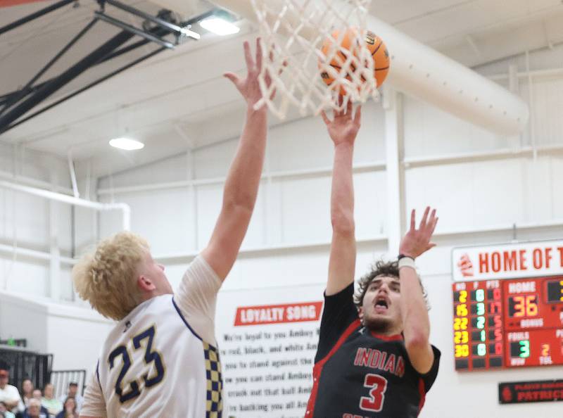 Indian Creek's Logan Schrader lets go of a shot over Marquette's Luke McCullough during the Class 1A Sectional game on Friday, March 6, 2026 at Amboy High School.