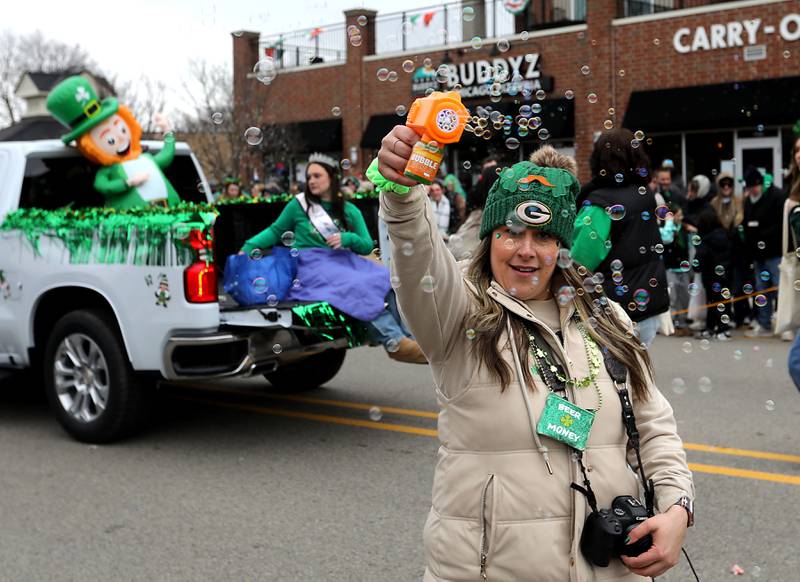 Bubbles are sprayed as the McHenry ShamROCKS the Fox Festival Parade makes its way along Green Street on Saturday, March 14, 2026. In McHenry.