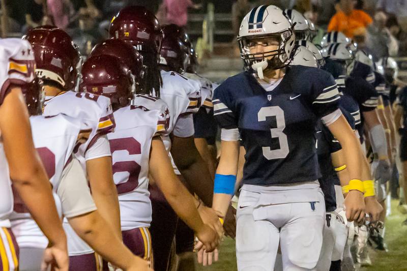 Fieldcrest players high-five Westmont players after a win on Friday, September 20, 2024 at Fieldcrest high school in Minonk.