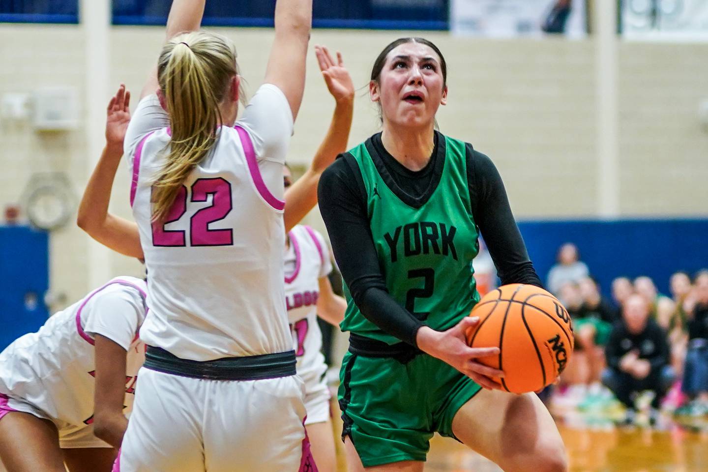 York's Anna Filosa (2) powers her way to the hoop against Batavia’s Ali Thomas (22) during a Class 4A Geneva Regional final basketball game at Geneva High School on Thursday, Feb. 20, 2025.