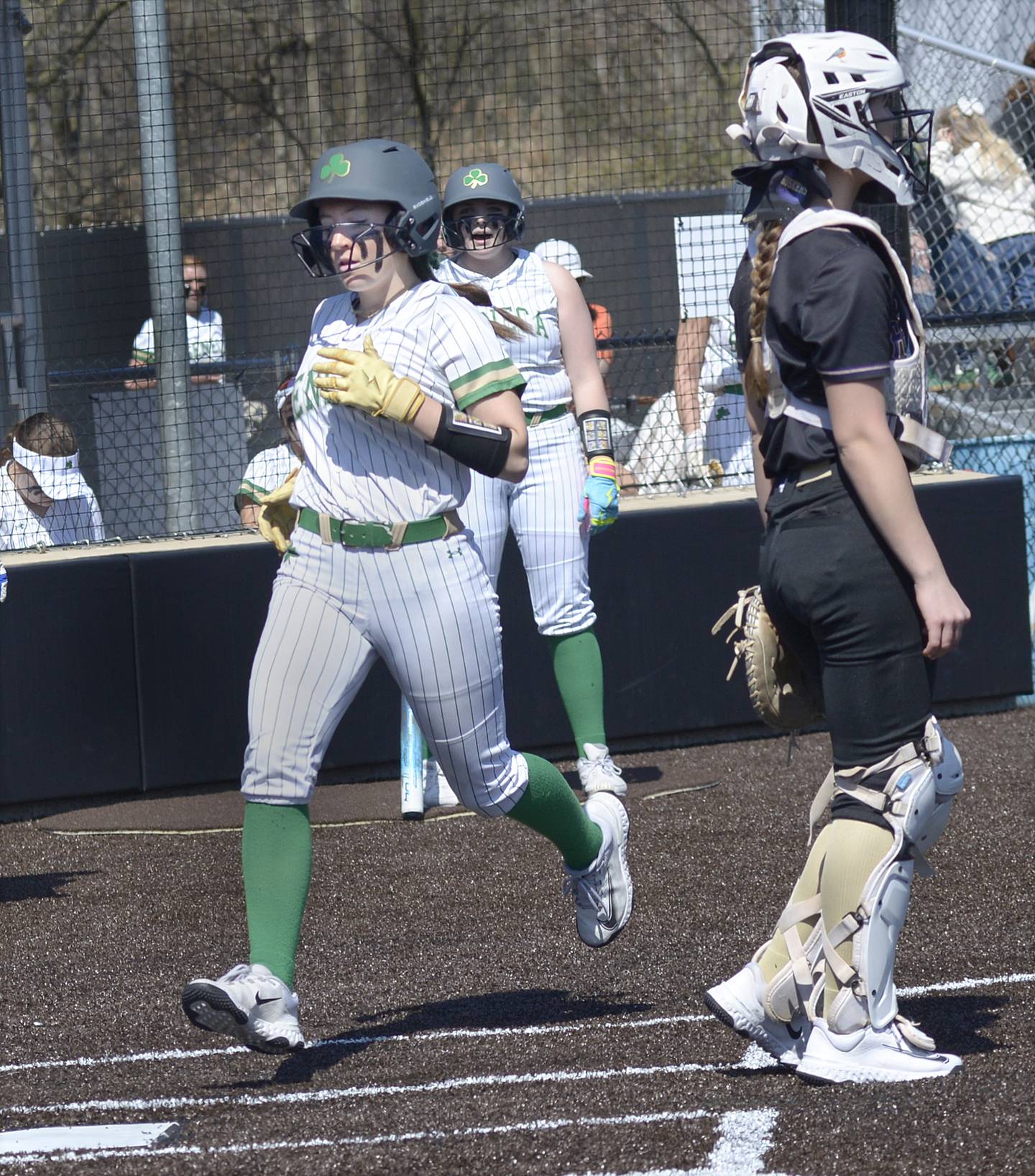Seneca’s Alyssa Zellers sets to cross the plate scoring Seneca’s first run against Serena Saturday at Seneca.