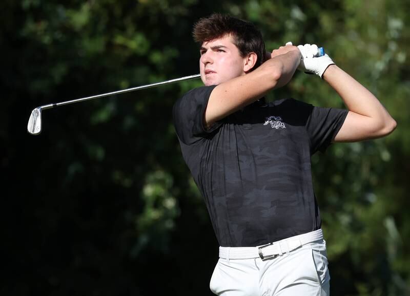Kaneland’s Brayden Seaton tees off on the par three fourth hole Monday, Sept. 23, 2024, during the Interstate 8 boys golf tournament at the Kishwaukee Country Club in DeKalb.