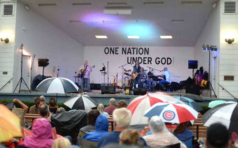 A light rain fell on a portion of the Jamboree Concert Series in Mt. Morris as the Chicago Tribute Anthology band returned to the band shell stage on Friday, July 25, 2025 re-creating many of the songs from Chicago, the classic rock band.