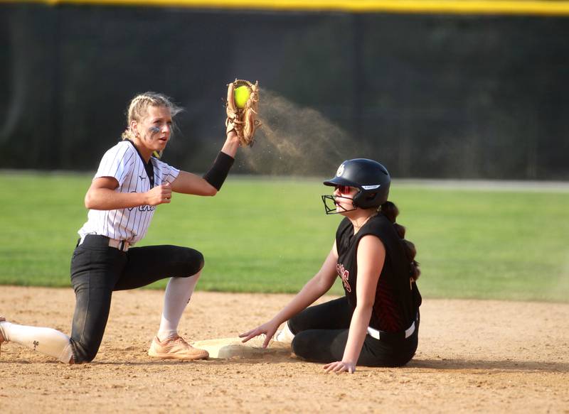 Montini’s Natalie Glosky is called out at second under the glove of Demi Lotus of St. Laurence during a Class 3A Benedictine Supersectional on Monday, June 9, 2025 in Lisle.