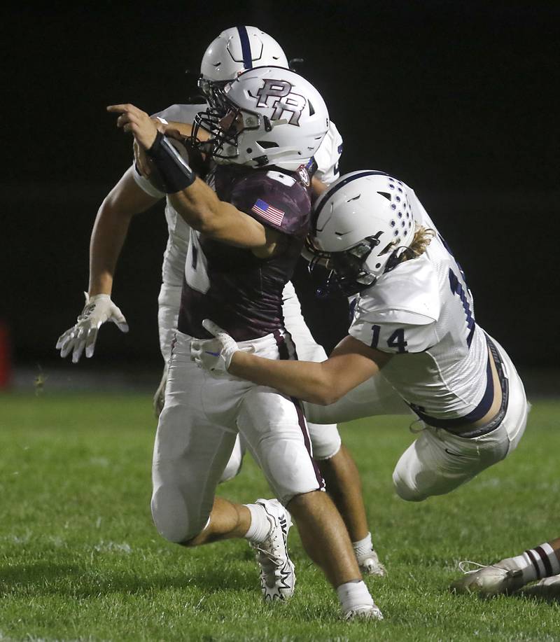 Prairie Ridge's Luke Vanderwiel is tackled by Cary-Grove's Ostin Hansen during a Fox Valley Conference football game on Friday, Sept. 27, 2024, at Prairie Ridge High School.