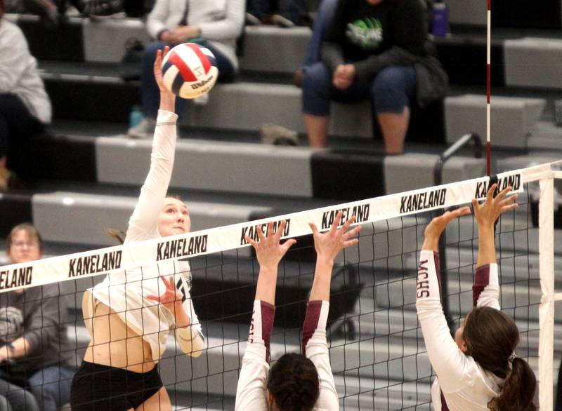 Kaneland’s Rosie Karl gets the ball over the net during a home game against Morris on Thursday, Oct. 13, 2022.