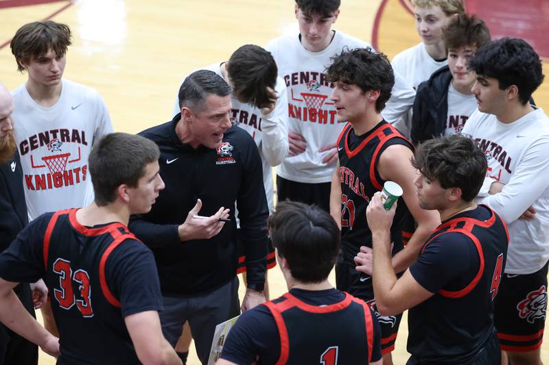 Lincoln-Way Central head coach Brian Flaherty talks to his players in a timeout during the Knight's 54-50 loss to Kankakee in the 75th Kankakee Holiday Tournament maroon bracket championship on Sunday, Dec. 28, 2025.