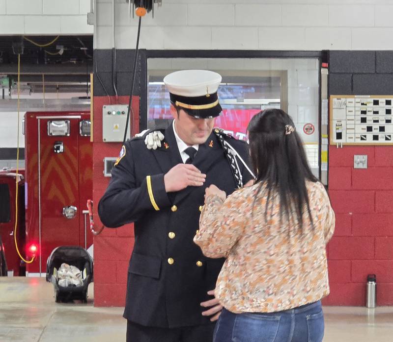 Princeton Fire Lt. Nick Dykstra is pinned Monday, March 3, 2025, during his swearing-in ceremony at the fire department.
