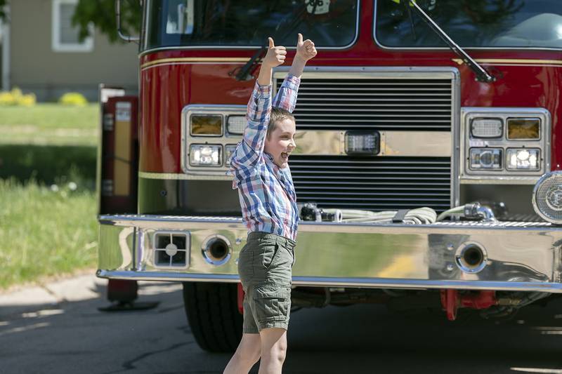 Lincoln fifth grader Loukas Constantino gives the thumbs up to his team Friday, May 16, 2025, after successfully landing the egg. Students at Lincoln School in Sterling were challenged to build contraptions that would save an egg dropped from a firefighting ladder truck.