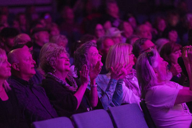 Fans of Head East sing along and gesture Saturday, April 22, 2023 during their show at the Dixon Historic Theatre.