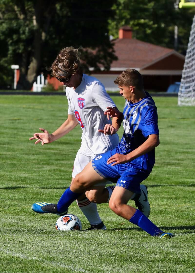 Streator's Connor Akin and Princeton's Asa Gartin battle for the ball Monday at Bryant Field.