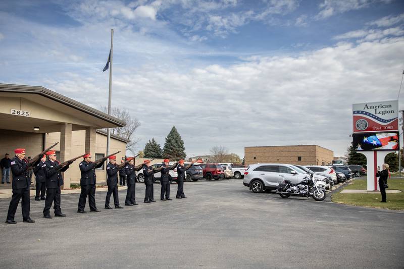 The Abraham Lincoln National Cemetery Memorial Squad participates in a rifle salute during a Veterans Day ceremony at American Legion Post 1080 in Joliet on Nov. 11, 2025.