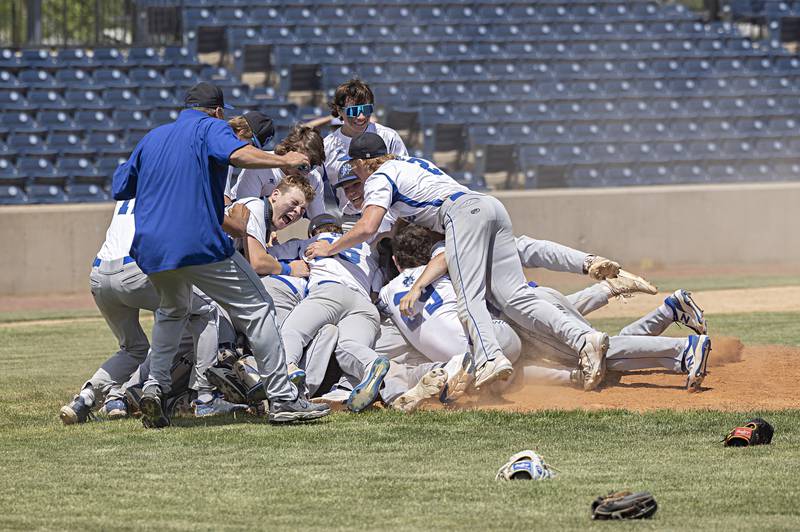 Newman celebrates their 3-2 supersectional baseball game against Chicago Hope Monday, May 29, 2023. Newman will play next week in Peoria for the class 1A state title.