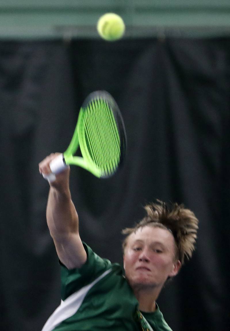 Crystal Lake South’s Jackson Schuetzle serves the ball during his IHSA 1A boys single tennis match against Alton Marguette’s  Stetson Isringhausen Thursday, May 26, 2022, at Heritage Tennis Club in Arlington Heights.