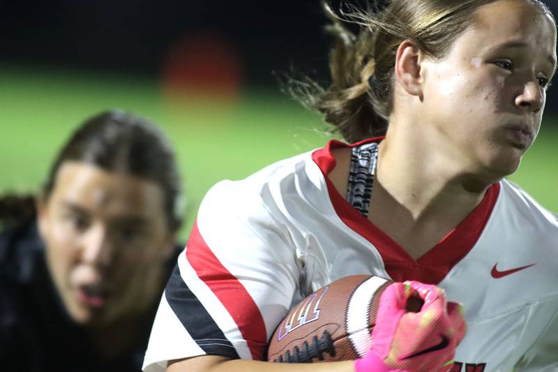 Huntley’s Mya Ouimette cruises with the ball in varsity flag football at Owen Metcalf Field on the campus of Crystal Lake Central High School in Crystal Lake on Tuesday, Sept. 16, 2025.